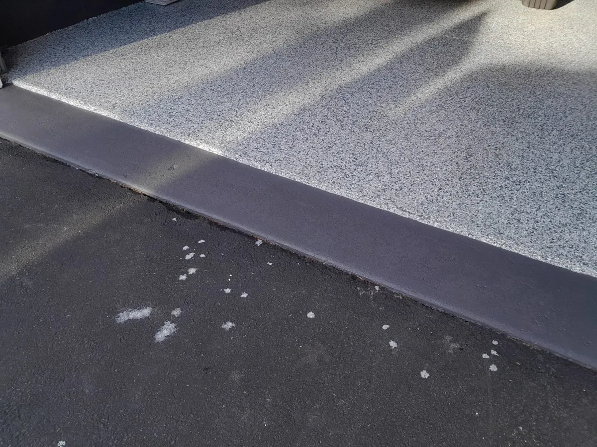 Polyaspartic garage floor with clean apron edge NJ